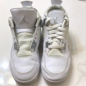 all white Under Armour sneakers